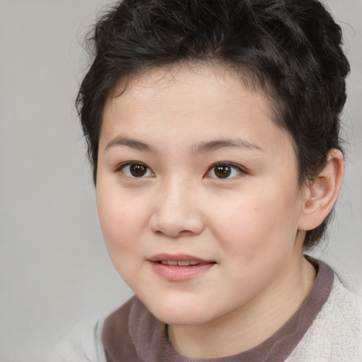 Joyful white child female with short  brown hair and brown eyes