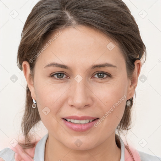 Joyful white young-adult female with medium  brown hair and grey eyes