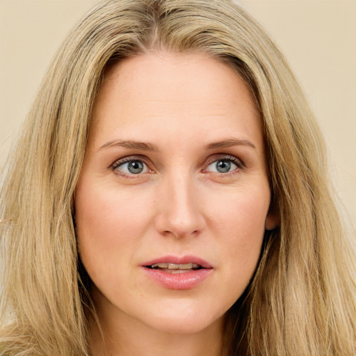 Joyful white young-adult female with long  brown hair and green eyes