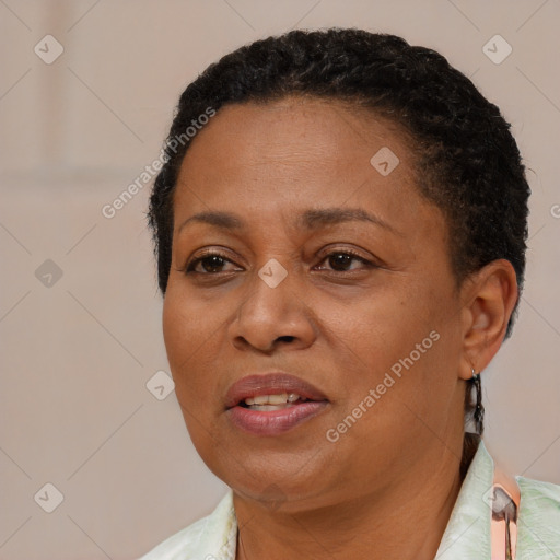 Joyful black adult female with short  brown hair and brown eyes