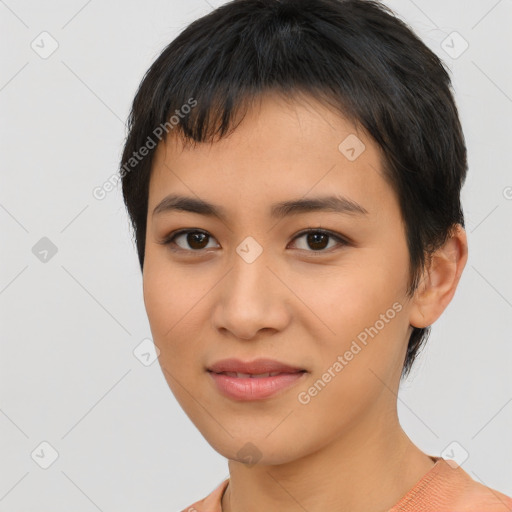 Joyful asian young-adult female with short  black hair and brown eyes