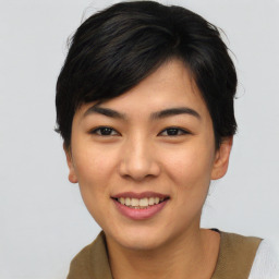 Joyful asian young-adult female with short  black hair and brown eyes