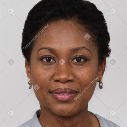 Joyful black adult female with short  brown hair and brown eyes