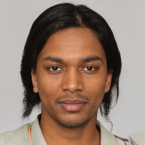 Neutral black young-adult male with medium  black hair and brown eyes