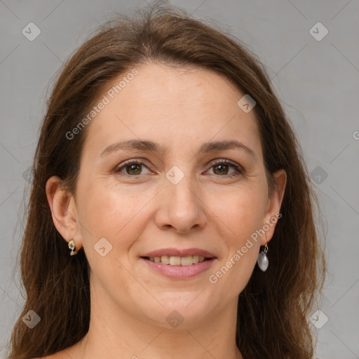 Joyful white adult female with medium  brown hair and grey eyes