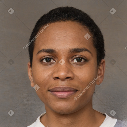 Joyful black young-adult female with short  black hair and brown eyes