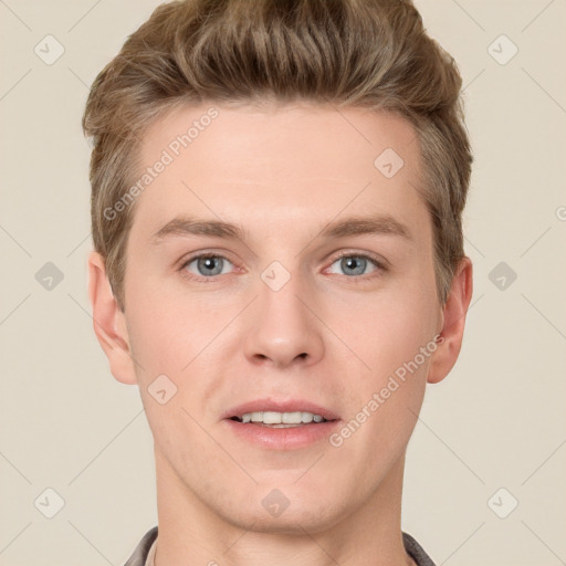 Joyful white young-adult male with short  brown hair and grey eyes