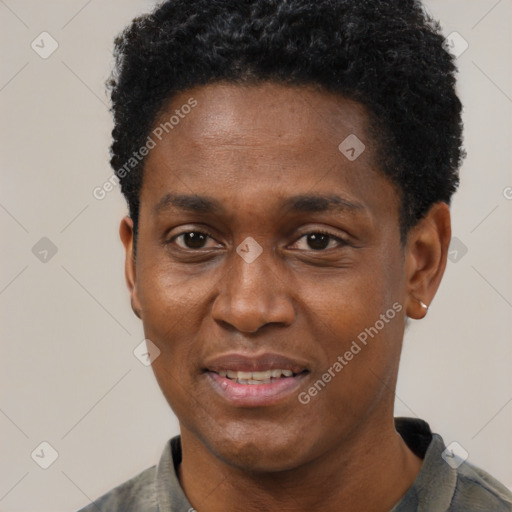 Joyful black young-adult male with short  black hair and brown eyes