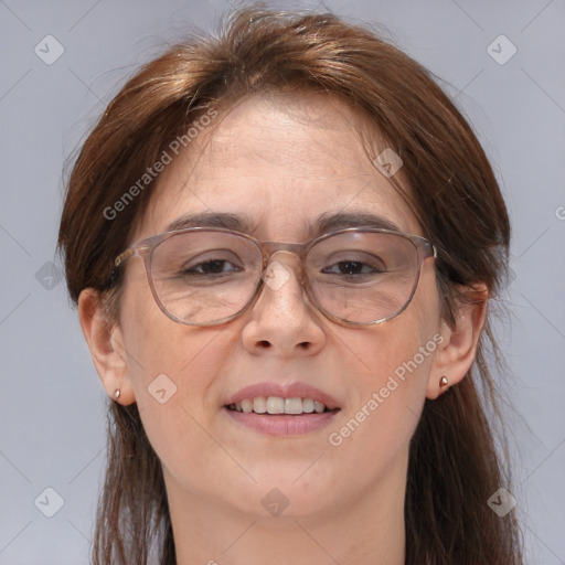 Joyful white adult female with medium  brown hair and brown eyes