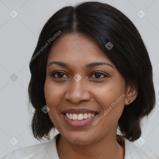 Joyful black young-adult female with medium  brown hair and brown eyes