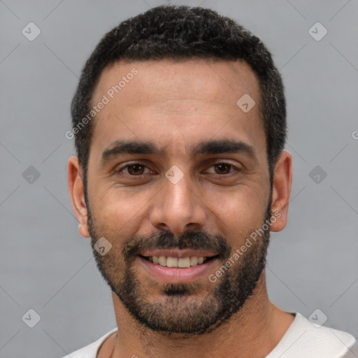 Joyful white young-adult male with short  black hair and brown eyes