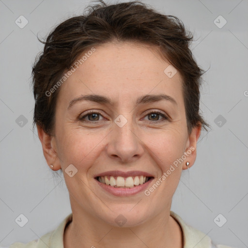 Joyful white adult female with short  brown hair and brown eyes