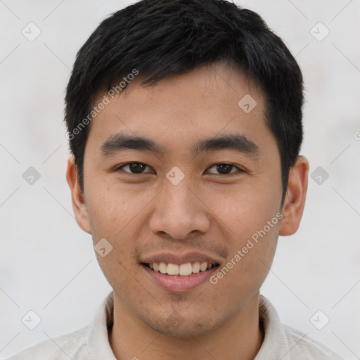 Joyful asian young-adult male with short  black hair and brown eyes