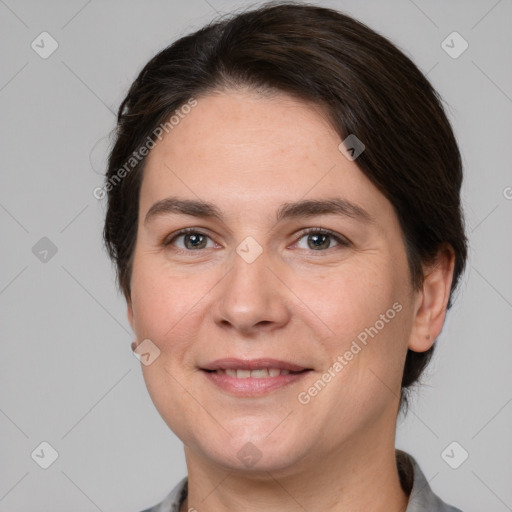 Joyful white adult female with medium  brown hair and brown eyes