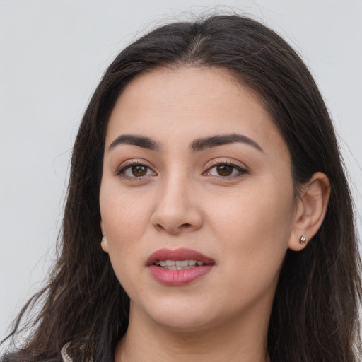 Joyful white young-adult female with long  brown hair and brown eyes