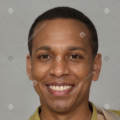 Joyful latino adult male with short  brown hair and brown eyes
