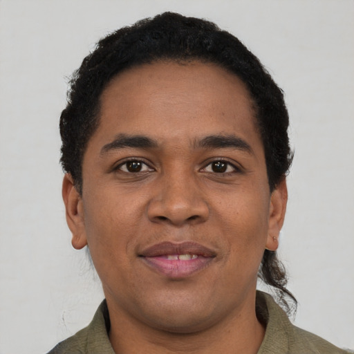 Joyful black young-adult male with short  black hair and brown eyes