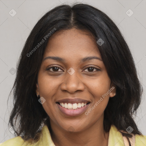 Joyful black young-adult female with medium  brown hair and brown eyes