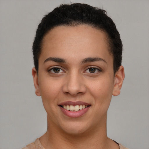 Joyful white young-adult female with short  brown hair and brown eyes
