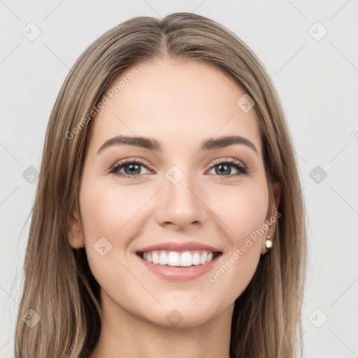 Joyful white young-adult female with long  brown hair and grey eyes