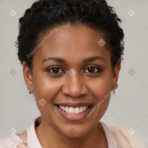 Joyful black young-adult female with short  brown hair and brown eyes