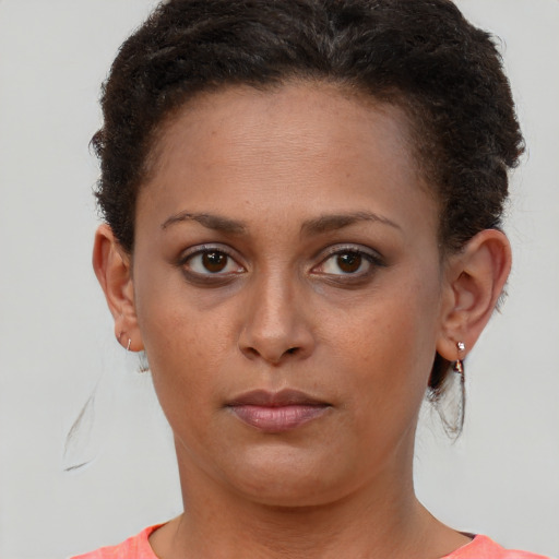Neutral black young-adult female with short  brown hair and brown eyes