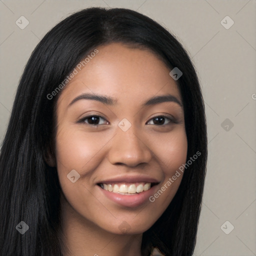 Joyful latino young-adult female with long  black hair and brown eyes