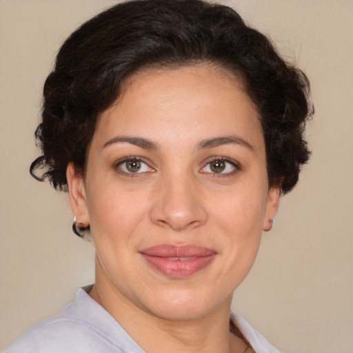 Joyful white adult female with short  brown hair and brown eyes
