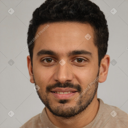 Joyful white young-adult male with short  black hair and brown eyes