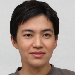 Joyful asian young-adult male with short  black hair and brown eyes