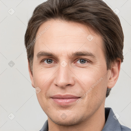 Joyful white adult male with short  brown hair and grey eyes