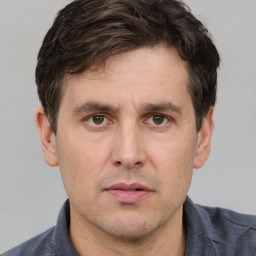 Neutral white adult male with short  brown hair and brown eyes