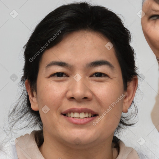 Joyful asian adult female with medium  brown hair and brown eyes