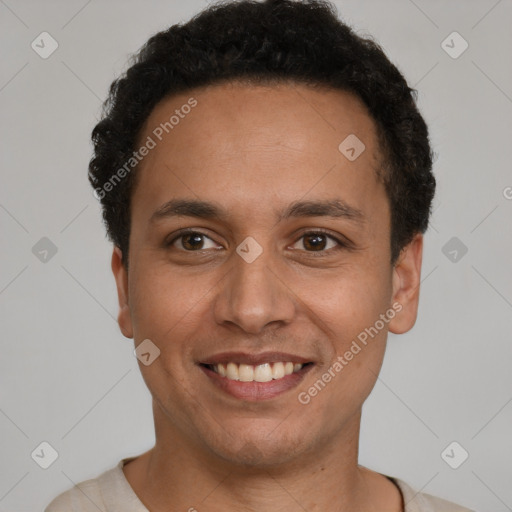 Joyful latino young-adult male with short  brown hair and brown eyes