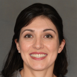 Joyful white adult female with medium  brown hair and brown eyes