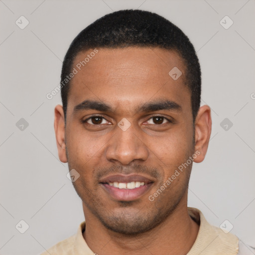 Joyful black young-adult male with short  black hair and brown eyes