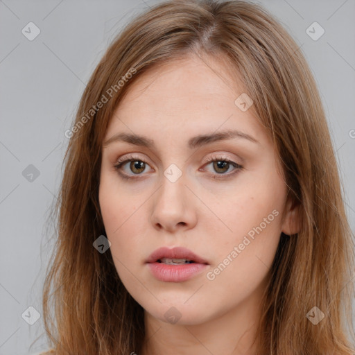 Neutral white young-adult female with long  brown hair and brown eyes