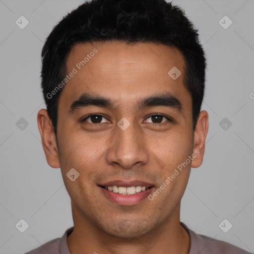 Joyful white young-adult male with short  black hair and brown eyes