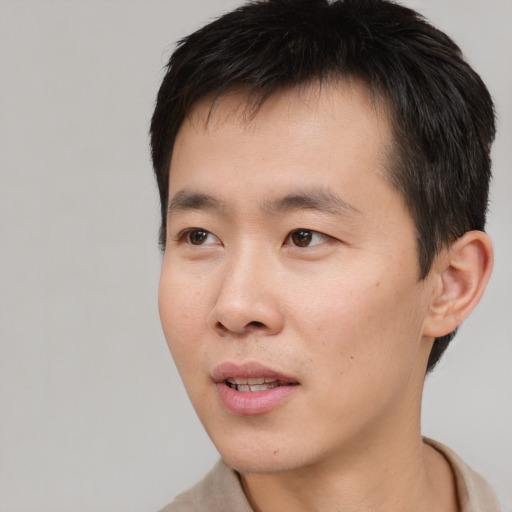 Neutral asian young-adult male with short  black hair and brown eyes