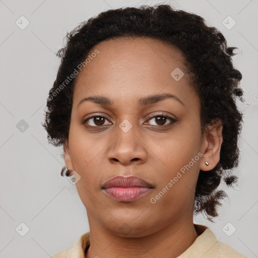 Joyful black young-adult female with medium  brown hair and brown eyes