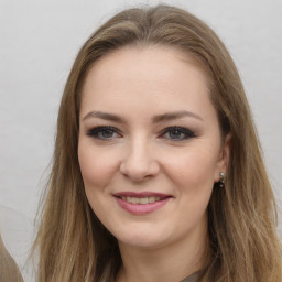 Joyful white young-adult female with long  brown hair and grey eyes