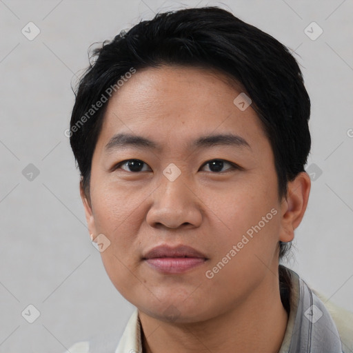 Joyful asian young-adult male with short  black hair and brown eyes