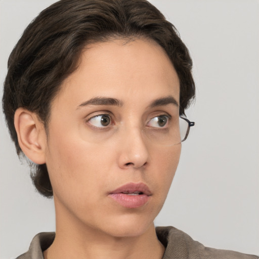 Neutral white young-adult female with short  brown hair and brown eyes