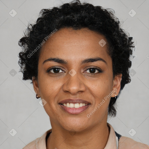 Joyful black young-adult female with short  black hair and brown eyes