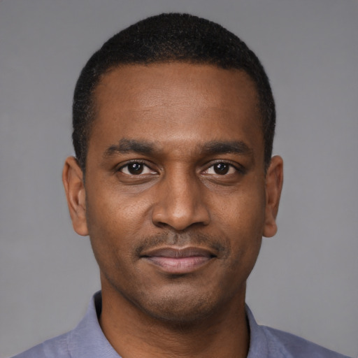 Neutral black young-adult male with short  brown hair and brown eyes