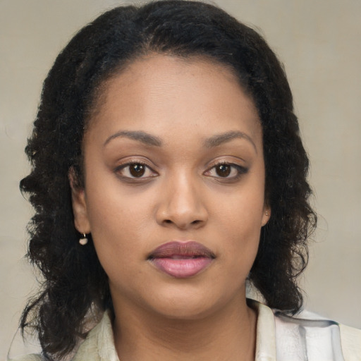 Neutral black young-adult female with long  brown hair and brown eyes