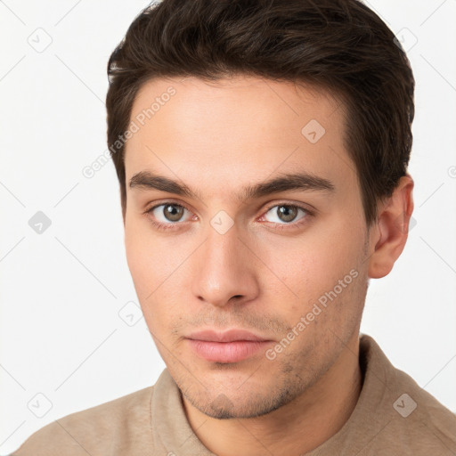 Neutral white young-adult male with short  brown hair and brown eyes