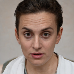 Joyful white adult female with short  brown hair and brown eyes