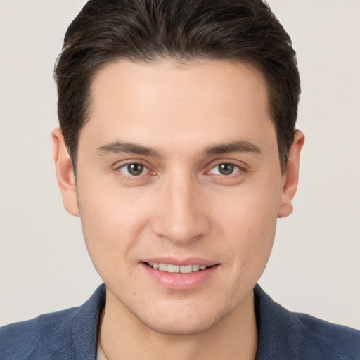 Joyful white young-adult male with short  brown hair and brown eyes