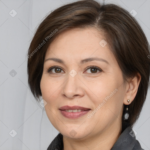 Joyful white adult female with medium  brown hair and brown eyes